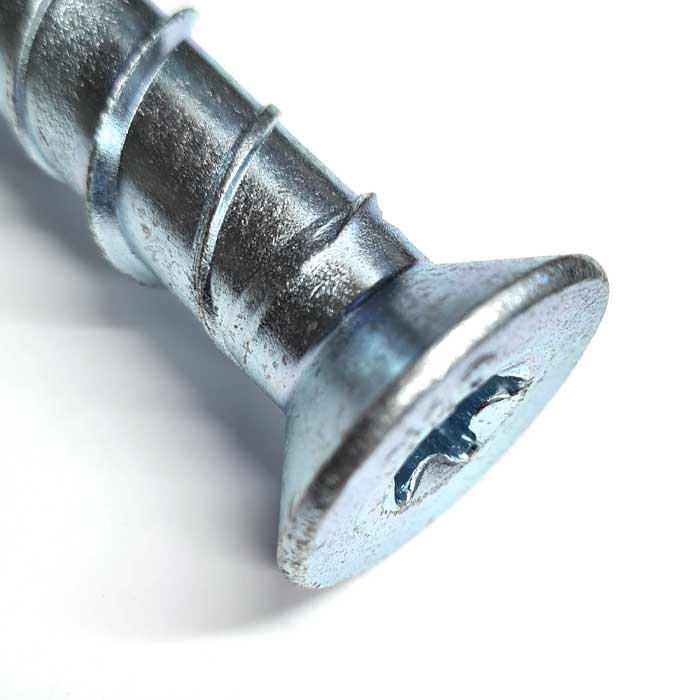 Image showing the head of a Countersunk Ankerbolt, Concrete Bolt, from Fusion Fixings with Torx drive recess. Manufactured in Grade 8.8 steel with a BZP coating.